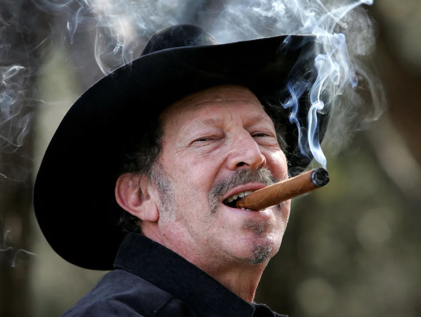 Kinky Friedman smoking a cigar