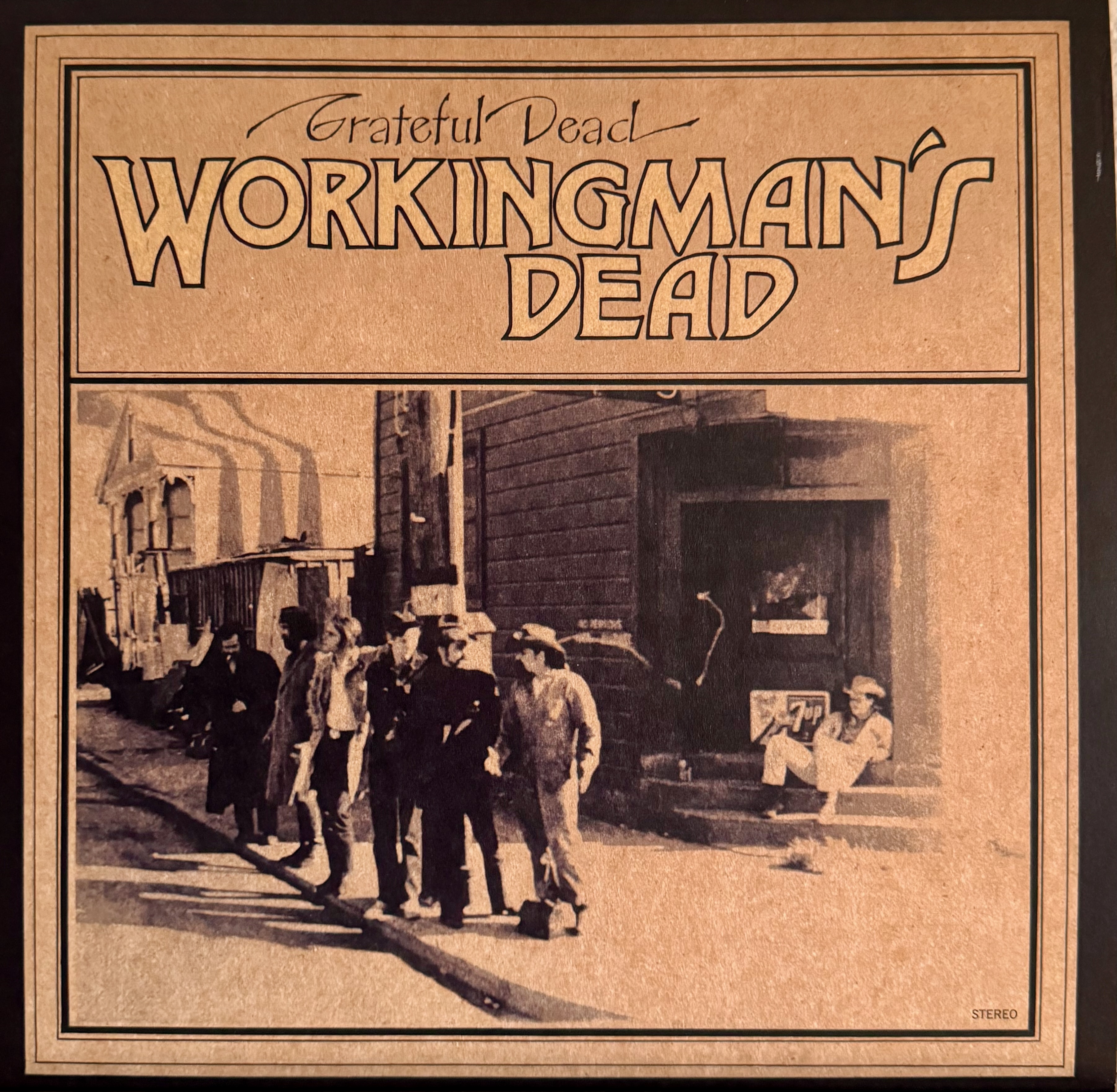 Workingman's Dead album cover - a sepia tinted portrait of the band in western clothes