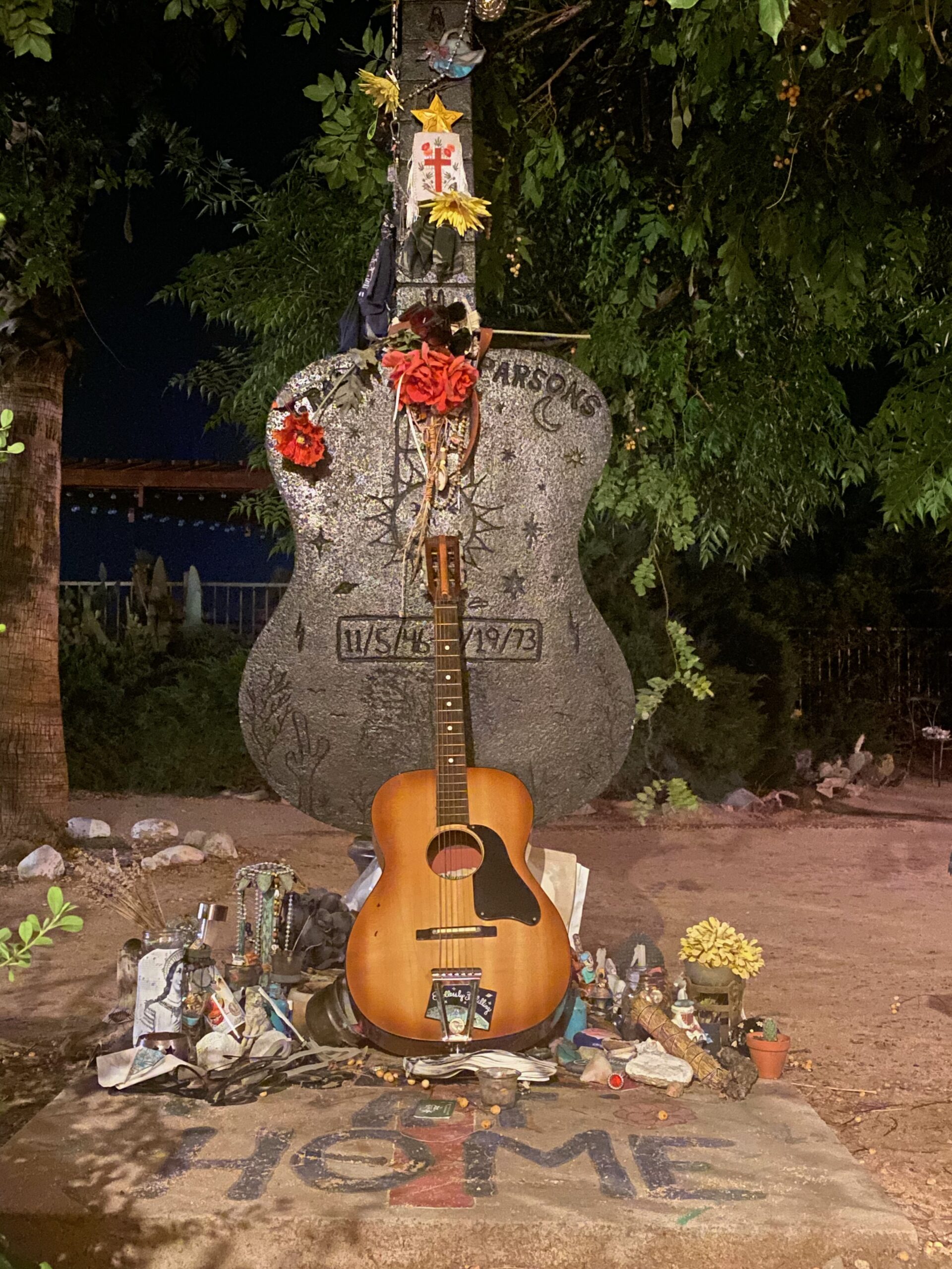 Guitar shaped memorial with mementos left by fans outside the motel room where Gram Parsons passed